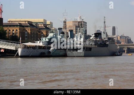 Rear view of HMS Belfast and Brazilian training ship Brasil (U27) moored together at the Pool of London, United Kingdom Stock Photo