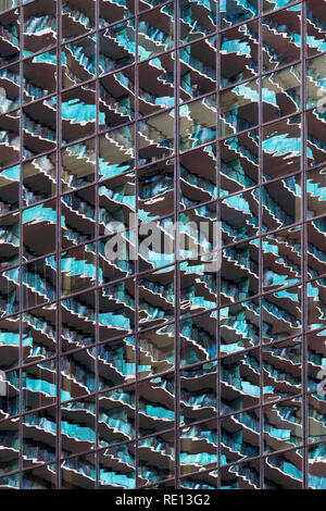 Reflections in glass of modern skyscraper form abstract image in the Brickell District of downtown Miami, Florida Stock Photo