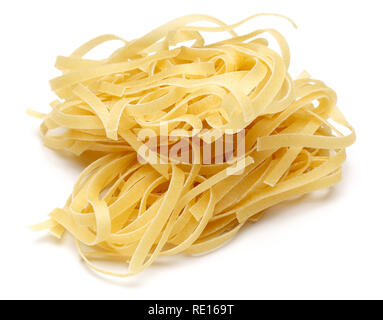 Uncooked tagliatelle pasta isolated on white background Stock Photo