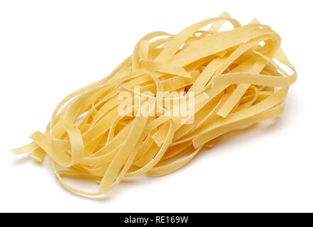 Uncooked tagliatelle pasta isolated on white background Stock Photo