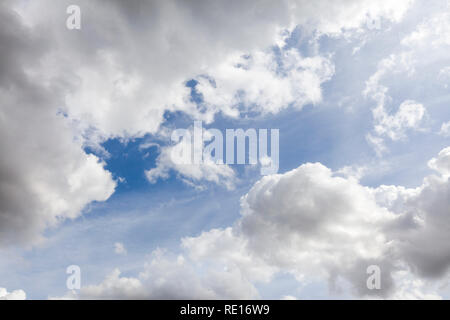 White summer clouds in a blue sky background Stock Photo