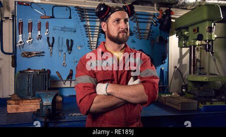 Closeup of auto mechanic. Auto repair service. Working tools background. Auto repair garage. Car mechanic. Car care business concept. Car service, rep Stock Photo