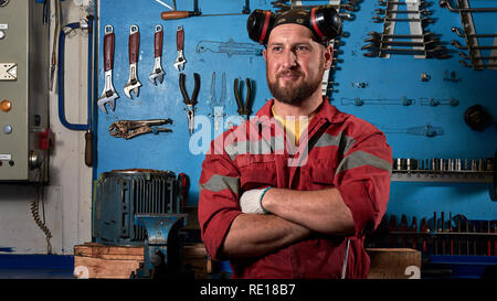 Closeup of auto mechanic. Auto repair service. Working tools background. Auto repair garage. Car mechanic. Car care business concept. Car service, rep Stock Photo