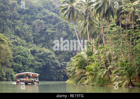 Boat trips on the Loboc river. Loboc Bohol. Pleasure boat on the River Loboc, Bohol, Philippines Stock Photo