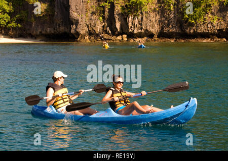 Tourist in kayak in Big Lagoon El Nido, Miniloc Island, Big Lagoon Palawan Philippines, Southeast Asia, Asia Stock Photo