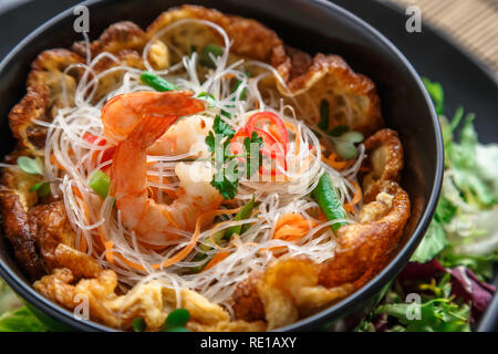 Asian salad with omelette, noodles and shrimps Stock Photo