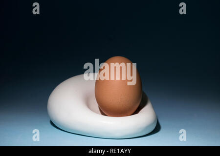 blue-ceramic-bowl-with-raw-white-quinoa-seeds-on-a-gray-concrete