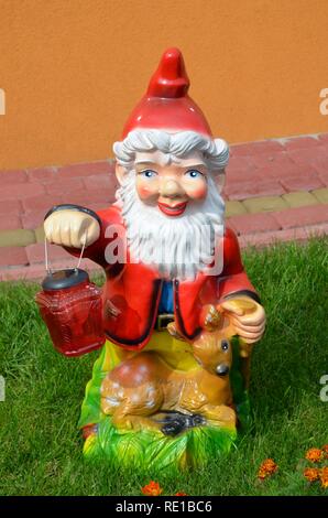 Garden gnome with a lamp Stock Photo