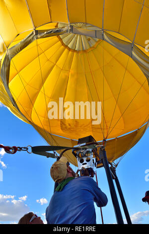 Looking up into hot air balloon canopy past the gas burner Stock Photo