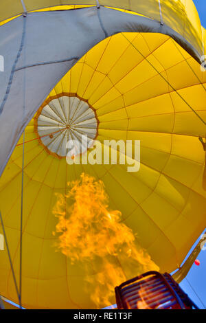 Looking up into hot air balloon canopy past the gas burner Stock Photo