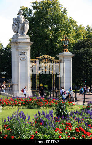Australia Gate with royal coat of arms in front a garden at the grounds of Buckingham Palace, London, United Kingdom