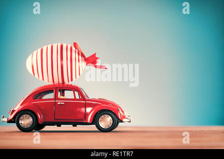 Red car with Easter egg Stock Photo