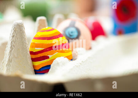 Detail of painted Easter egg with different forms and bright colors. Stock Photo