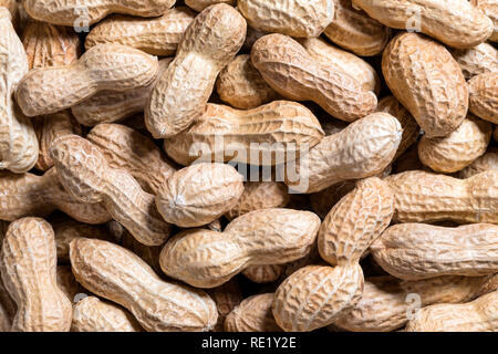 Peanuts in a shell background, close-up, top view Stock Photo