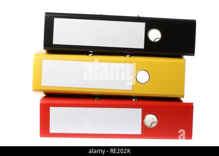 Black, yellow and red ring binders, blank labels Stock Photo