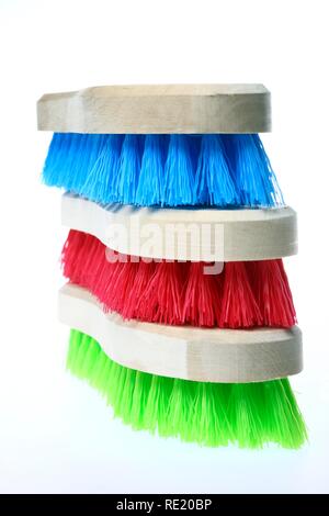 Colourful scrubbing brushes, wooden with plastic bristles Stock Photo
