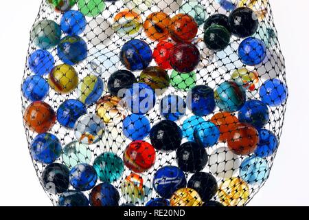 Glass marbles, different colours and sizes, in a carry net Stock Photo