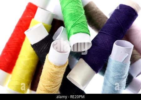 Different coloured sewing cotton reels Stock Photo