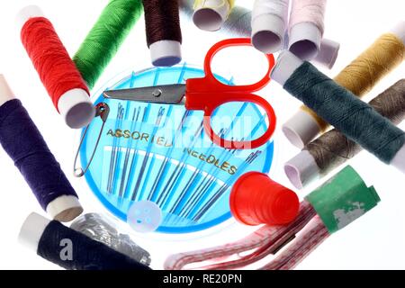 Travel sewing kit with thread, needles, small scissors, thimble and a tape measure Stock Photo