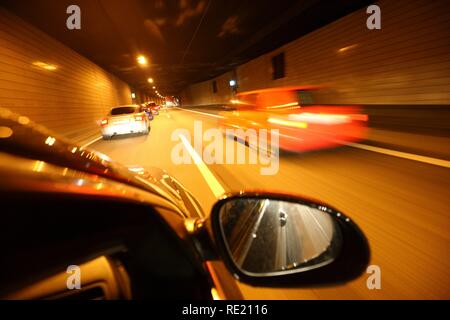 Drive during rush hour on the highway A40, so-called Ruhrschnellweg, city tunnel Essen, Ruhrgebiet region Stock Photo