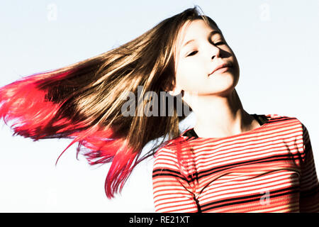 Tween Girl Is Isolated Against The Sky While Twirling And Swinging