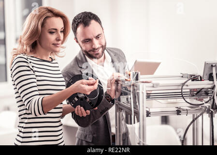 Creative designers learning printing models on 3D printer Stock Photo