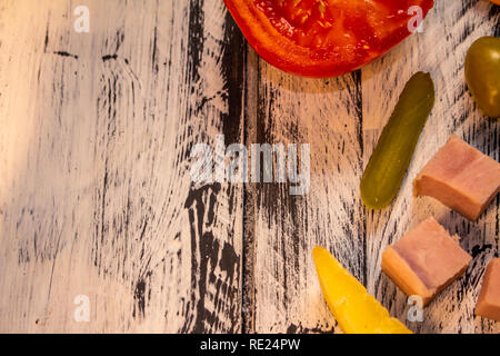 Salty foods on a white and black rustic table. Food for snack. Stock Photo