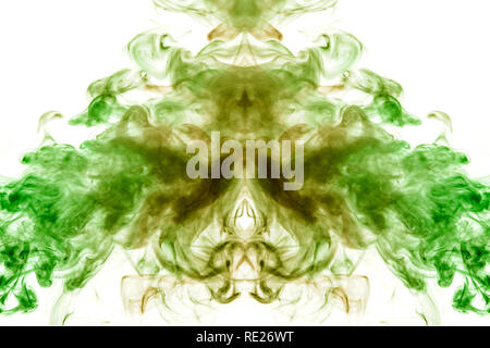 Symmetrical pattern of dark green and burgundy red color on a white isolated background in the form of a mystical animal or ghost made with the help o Stock Photo