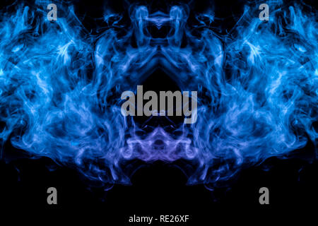 A background of pink, blue and white wavy smoke in the shape of a ghost's head or a man of mystical appearance on a black isolated ground. Bright abst Stock Photo