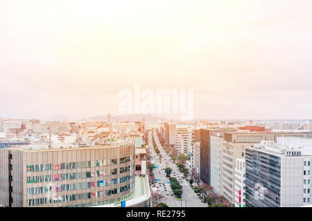 Asia Business concept for real estate and corporate construction - panoramic urban townscape aerial view with hakata port tower under bright blue sky  Stock Photo