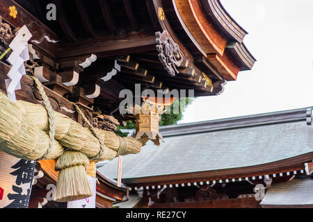 Asia culture concept - the beautiful roof decoration art and shimenawa rope of traditional kushida shrine in Fukuoka Japan Stock Photo