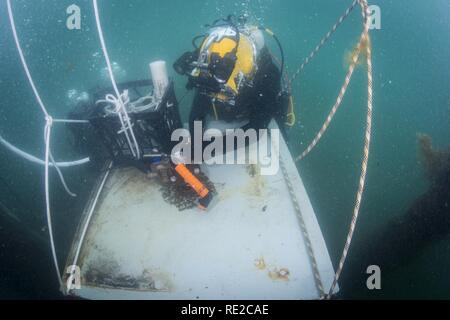 Petty Officer 3rd Class Sean Black, assigned to Mobile Diving Salvage Unit (MDSU) 1, prepares for an underwater welding exercise during Exercise Dugong 2016, in Sydney, Australia, Nov. 9, 2016. Dugong is a bi-lateral U.S Navy and Royal Australian Navy training exercise, advancing tactical level U.S. service component integration, capacity, and interoperability with Australian Clearance Diving Team (AUSCDT) ONE. Stock Photo