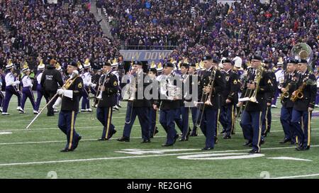 JOINT BASE LEWIS-MCCHOROD, Wash. – Soldiers from the I Corps Band march onto the field prior to the Washington Huskies and USC Trojans football game in Seattle Nov. 12. The I Corps Band performed both America the Beautiful and the Star Spangled Banner as part of UW’s Salute to Service. Stock Photo