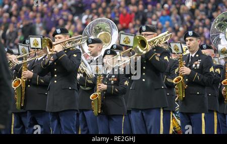 JOINT BASE LEWIS-MCCHOROD, Wash. – Soldiers from the I Corps Band perform America the Beautiful alongside the University of Washington Marching Band prior to the Washington Huskies and USC Trojans football game in Seattle Nov. 12. The I Corps Band performed both America the Beautiful and the Star Spangled Banner as part of UW’s Salute to Service. Stock Photo