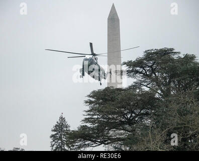 Washington, USA. 19th Jan 2019. Marine One, with United States President Donald J. Trump aboard, arrives on the South Lawn of the White House in Washington, DC on Saturday, January 19, 2019 following a trip to Dover AFB where the President met with the families of four Americans who were killed in an explosion Wednesday in Syria. Credit: Ron Sachs/Pool via CNP /MediaPunch Credit: MediaPunch Inc/Alamy Live News Stock Photo