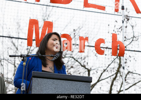 Washington, USA. 19th Jan 2019.  Monserrat Padilla, coordinator at the Washington Immigrant Solidarity Network and transgender advocate, speaks at the pre-march rally for the Womxn's March Seattle 2019. Saturday’s March and Rally, organized by Seattle Womxn Marching Forward in collaboration with MLK Day organizers, will be followed on Sunday by a day of action and Monday MLK Day events honoring Martin Luther King Jr. Sunday’s Womxn Act on Seattle is a citywide day of learning, supporting, sharing, and acting on behalf of nonprofit organizations, grassroots and social justice groups in Seattle. Stock Photo