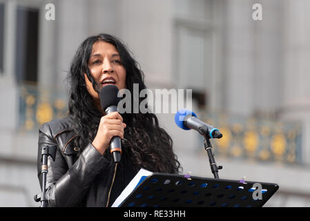 San Francisco, USA. 19th January, 2019. The Women's March San Francisco begins with a rally at Civic Center Plaza in front of City Hall. Writer and consultant Natasha Singh, who works closely with Asha Rising, Freedom forward, and Center for Domestic Peace, addresses the crowd. Her writing has appeared in The Atlantic, The New York Times and several anthologies. Credit: Shelly Rivoli/Alamy Live News Stock Photo