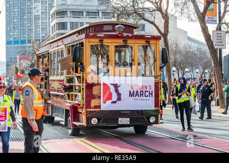 San Francisco, USA. 19th Jan 2019.  Old wine trolley carries Participants to the Women's March on Market street in downtown San Francisco Stock Photo
