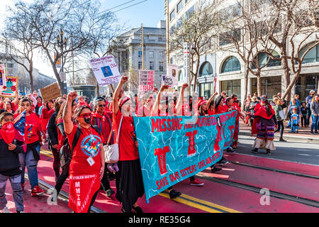San Francisco, USA. 19th Jan 2019.  Members of an Indigenous group participate at the Women's March and march on Market street in downtown San Francisco