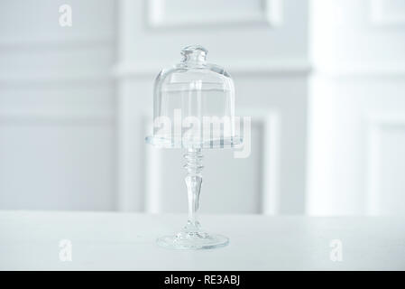 Glass vase for cookies with cover, on white background Stock Photo