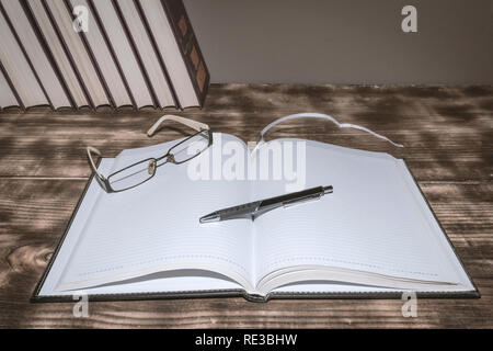 A book on a table without an inscription, ideal for capturing notes Stock Photo