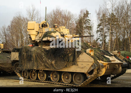 U.S. Soldiers of 2nd Battalion, 5th Cavalry Regiment, 1st Armored Brigade Combat Team, 1st Cavalry Division move out for phase two of Combined Resolve XI at the Grafenwoehr Training Range in Germany, Jan. 17, 2019. The 2-5 CAV is deployed to Europe in support of Atlantic Resolve, an enduring training exercise between U.S. and NATO forces. (U.S. Army National Guard video by Sgt. Marcel Pugh and Spc. Hannah Tarkelly, 382nd Public Affairs Detachment/ 1st ABCT, 1st CD/Released) Stock Photo