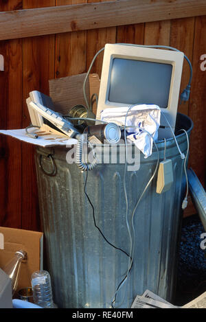 Outdated technology thrown in trash can, USA Stock Photo