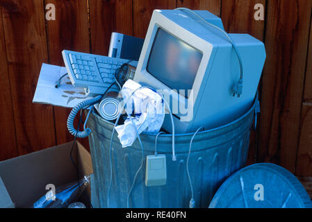 Outdated technology thrown in trash can, USA Stock Photo