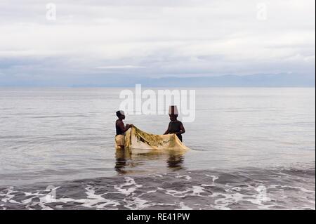 Women fishing with a net in Antongil Bay, Maroantsetra, Madagascar, Africa Stock Photo