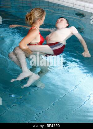 Individual therapy in a heated pool, physical therapy in a neurological rehabilitation centre, Bonn, North Rhine-Westphalia Stock Photo