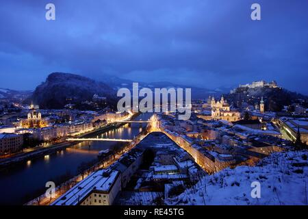 Old town with the Kollegienkirche church, the cathedral and Festung Hohensalzburg fortress, in the evening, winter, Salzburg Stock Photo