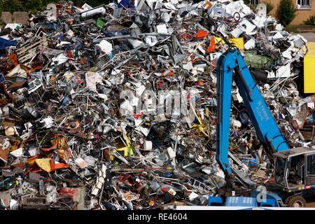 Scrap being loaded onto barges to be shipped to smelters and melted down again, port of Gelsenkirchen, at the Rhine-Herne Canal Stock Photo