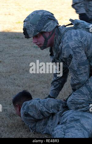 A Senior Airman of the 633rd Security Forces Squadron receives ...