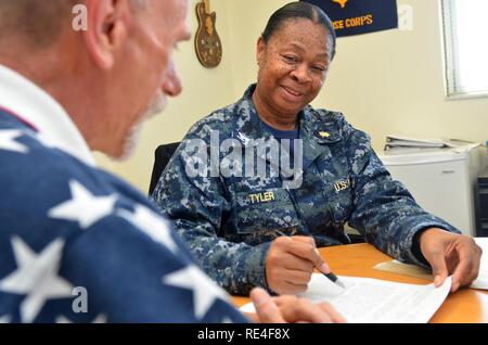 MAYPORT, Fla. (Nov. 10, 2016) – Capt. Evelyn Tyler, Naval Branch Health Clinic (NBHC) Mayport officer in charge, discusses customer service goals and milestones with staff member. NBHC Mayport is one of Naval Hospital (NH) Jacksonville’s six health care facilities located across Florida and Georgia. The command is comprised of the Navy's third largest hospital and five branch health clinics.  Of its patient population (163,000 active and retired sailors, soldiers, Marines, airmen, guardsmen, and their families), almost 85,000 are enrolled with a primary care manager and Medical Home Port team  Stock Photo